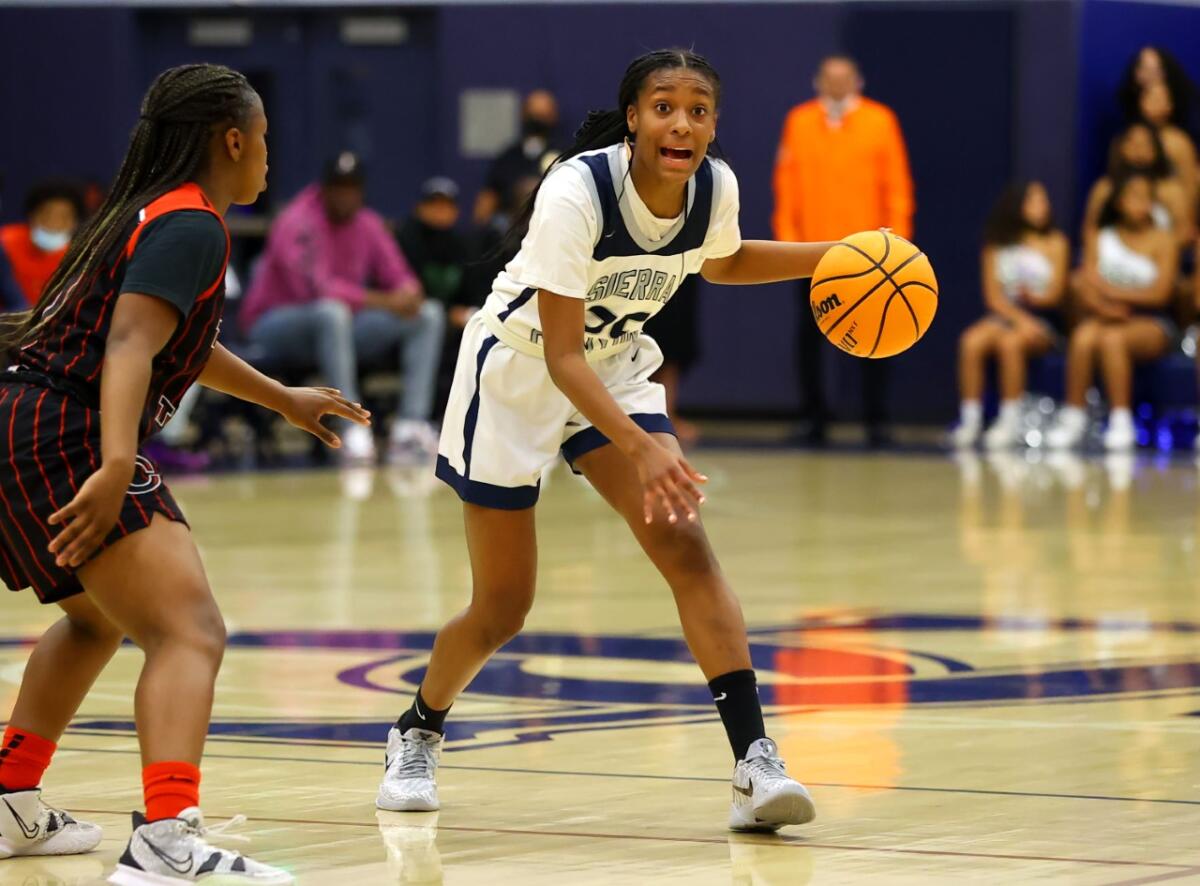 Izela Arenas of Sierra Canyon dribbles against Corona Centennial on Saturday night in an Open Division playoff game.