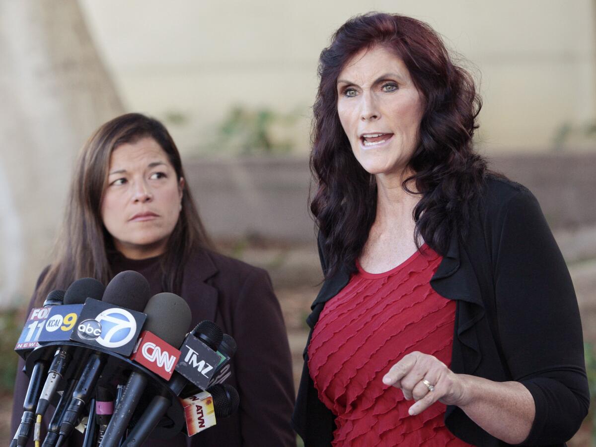 This Sept. 20, 2012, photo shows Cindy Lee Garcia, right, one of the actresses in the film "Innocence of Muslims," and attorney M. Cris Armenta at a news conference before a Superior Court hearing in Los Angeles. A federal appeals court ordered YouTube on Wednesday to take down an anti-Muslim film that sparked violence in many parts of the Middle East.