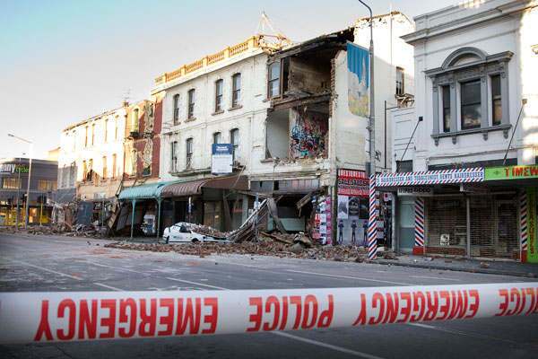 Bricks from a damaged building lie on a crushed car after a 7.1 magnitude earthquake struck on September 4, 2010 in Christchurch, New Zealand. Civil Defence have declared a state of emergency and there has been considerable damage across the city and surrounding areas.