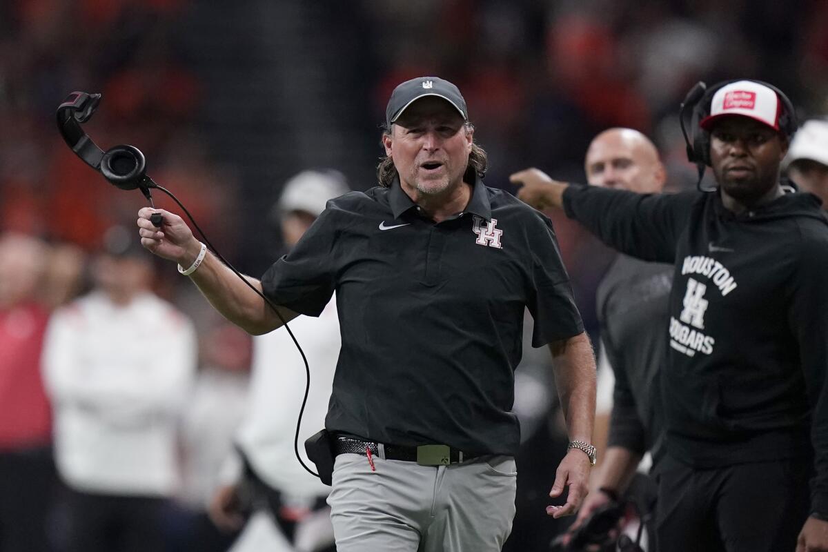 Houston coach Dana Holgorsen reacts to a call during the second half of the team's NCAA college football game against UTSA on Saturday, Sept. 3, 2022, in San Antonio. (AP Photo/Eric Gay)