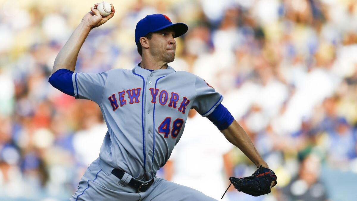 New York Mets starting pitcher Jacob deGrom pitches against the Dodgers.