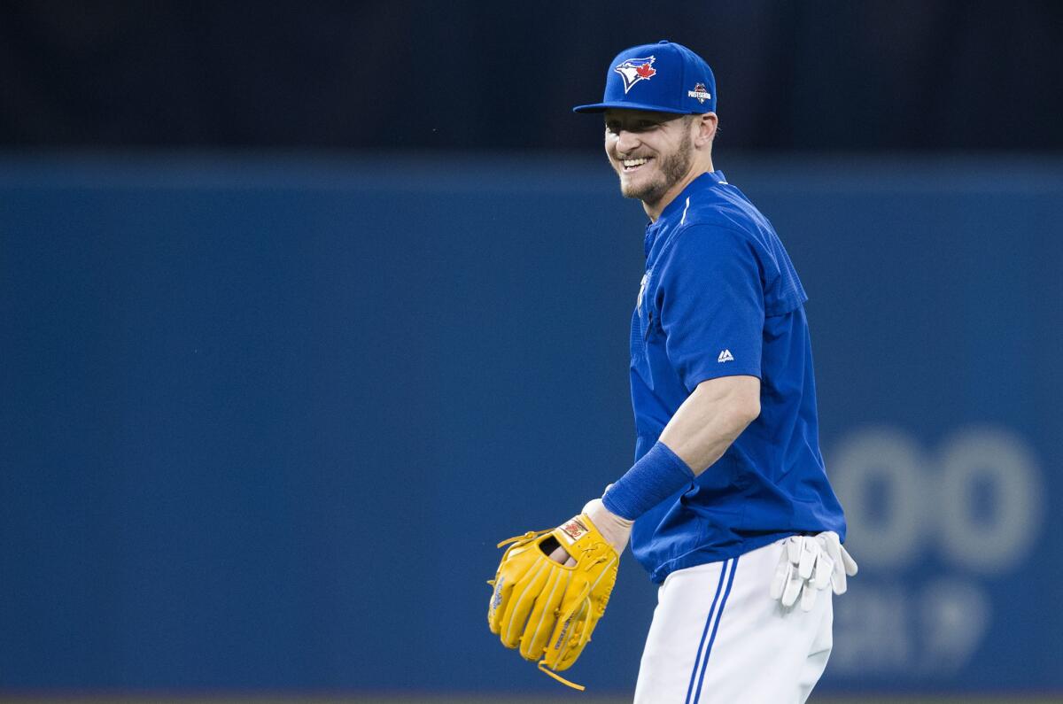 Blue Jays slugger Josh Donaldson laughs during a team workout at the Rogers Centre on Wednesday.