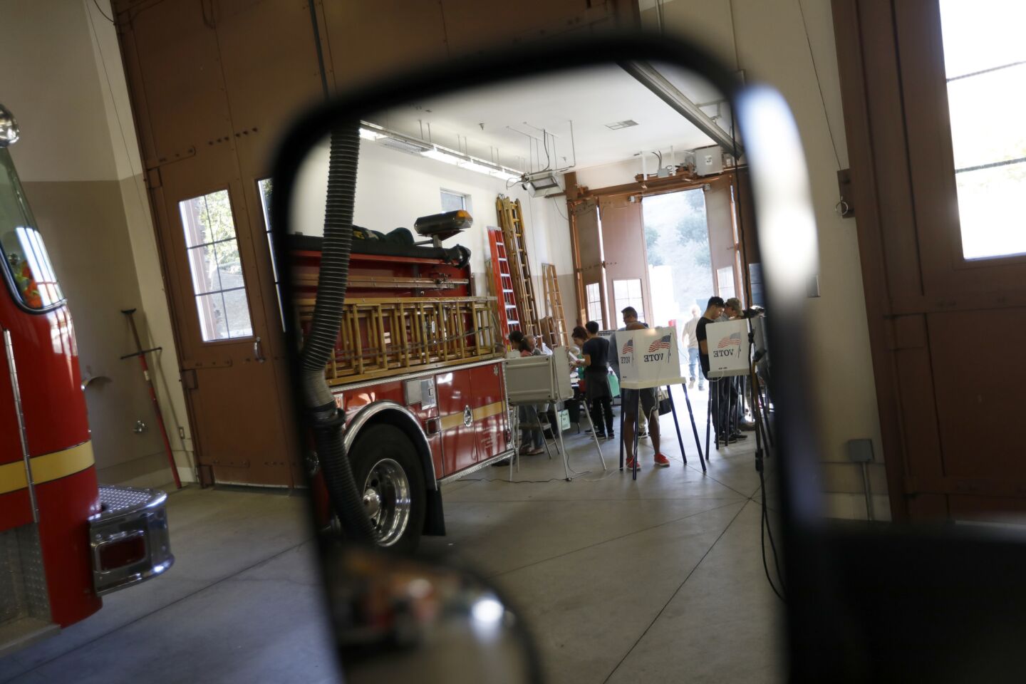 Voters fill the booths Tuesday at Los Angeles County Fire Station No. 124 in Stevenson Ranch, Calif.