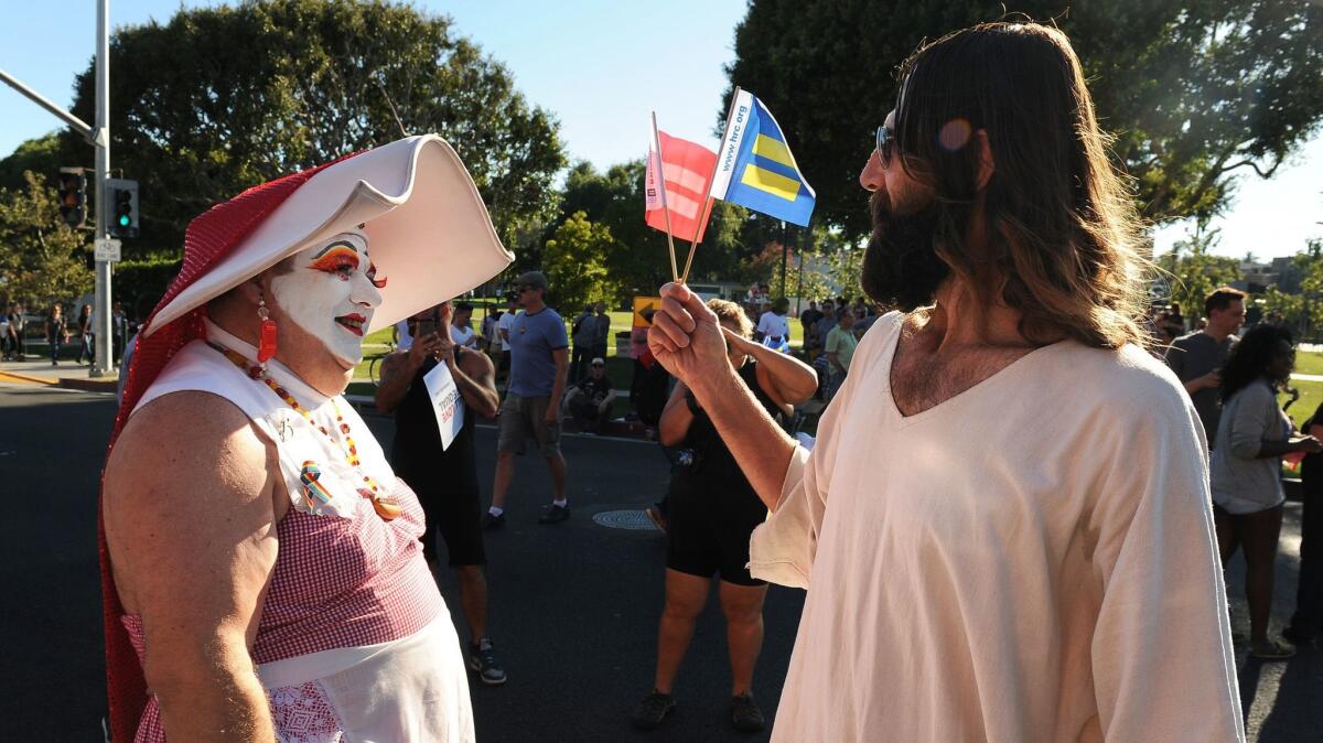 A drag queen and Kevin Short chat before a rally in West Hollywood in 2013 after the U.S. Supreme Court cleared the way for same-sex marriage in California.