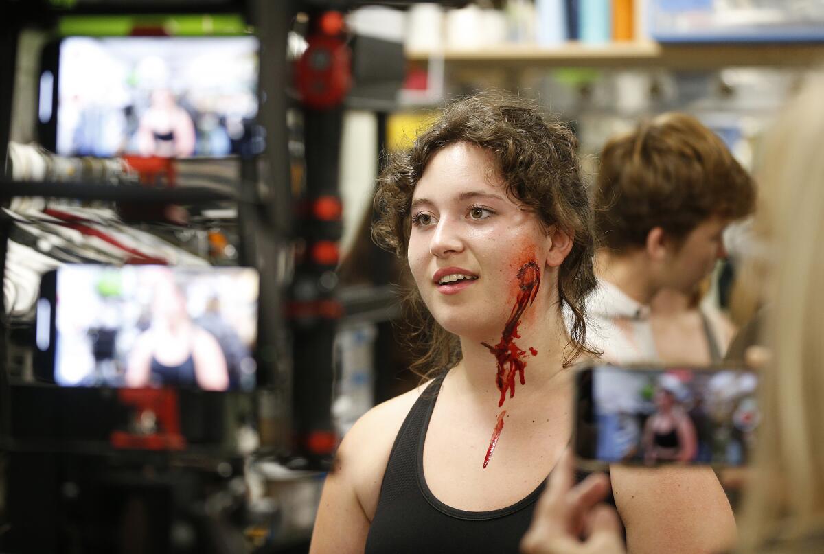 Theater student Scarlett Wheaton prepares to be a victim of a simulated mass casualty incident.