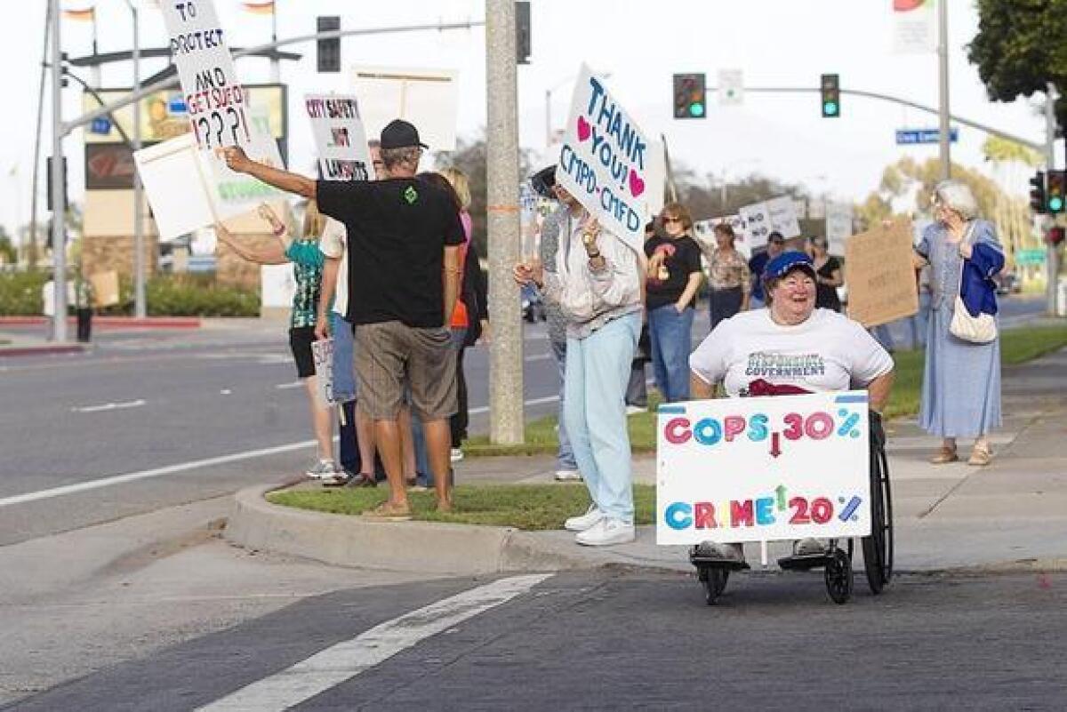 Costa Mesa residents rally in support of police on Tuesday night.