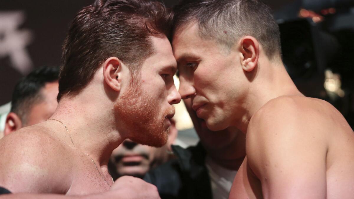 Canelo Alvarez, left, and Gennady Golovkin pose during their weigh-in Friday at T-Mobile Arena in Las Vegas.