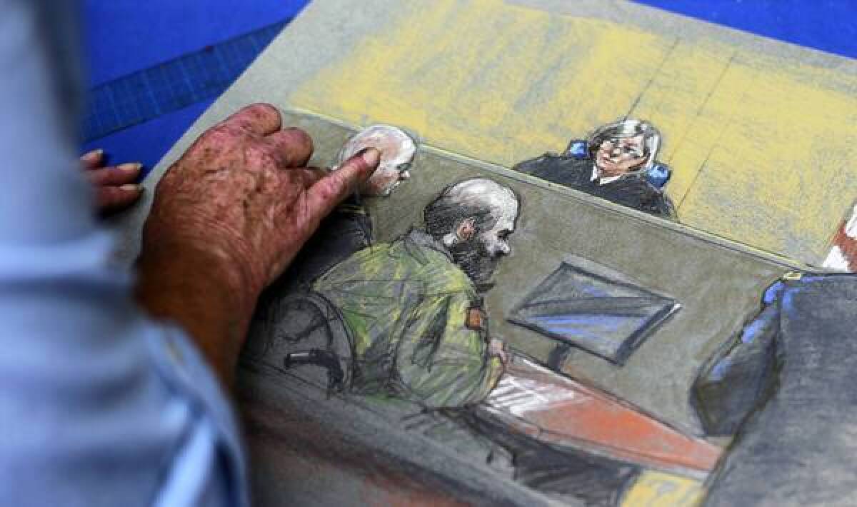 Artist Brigitte Woosley works on a sketch showing Maj. Nidal Malik Hasan as testimony begins in his sentencing at Ft. Hood.
