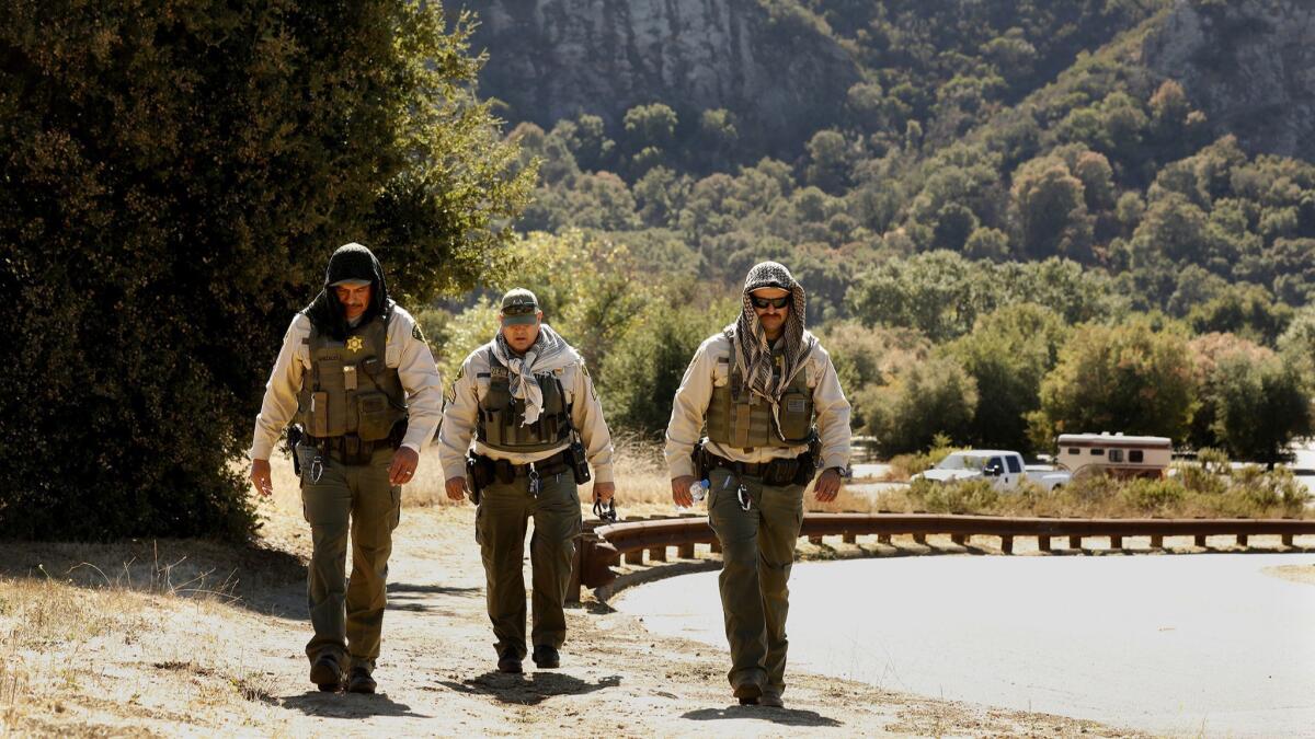 L.A. County Sheriff’s Department investigators search Malibu Creek State Park after the arrest of 43-year-old Anthony Rauda, who has since been charged in a series of shootings that left one man dead and sparked panic in the idyllic community.