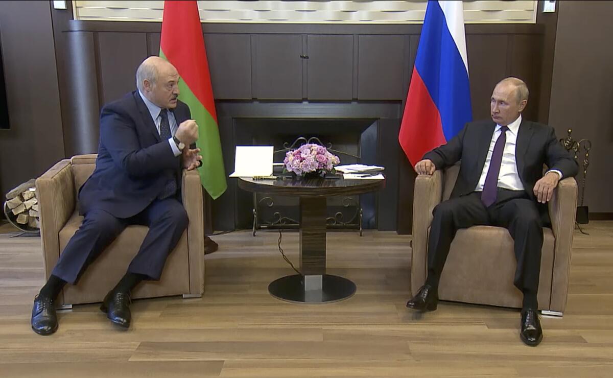 Russian President Vladimir Putin, right, and Belarusian President Alexander Lukashenko meet in Sochi, Russia.