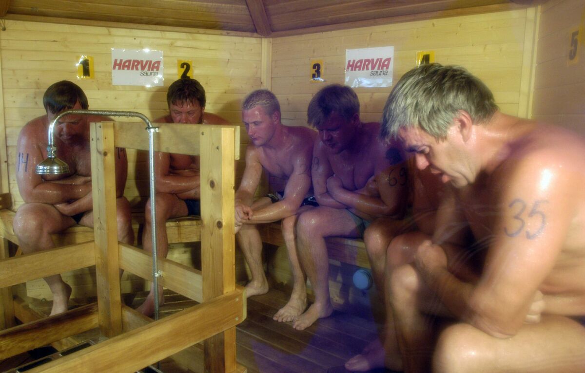 In this Aug. 2, 2003, photo, competitors sweat it out during the Sauna World Championships in Heinola, Finland. Frequent sauna baths may help you live longer, a study of Finnish men suggests.