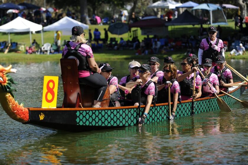 EL MONTE, CA- October 15, 2016: The Los Angeles Pink Dragon's during the LA Dragon Boat Festival on Saturday, October 15, 2016. Dragon boat racing has become a totem sport for breast cancer survivors and the Los Angeles Pink Dragons are the first breast cancer survivor team in California. (Mariah Tauger / For the Times)
