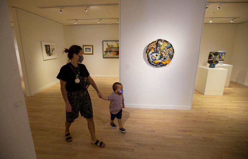 Jen Kim and her son Paxton, 3, look at art at the Orange County Museum of Art.