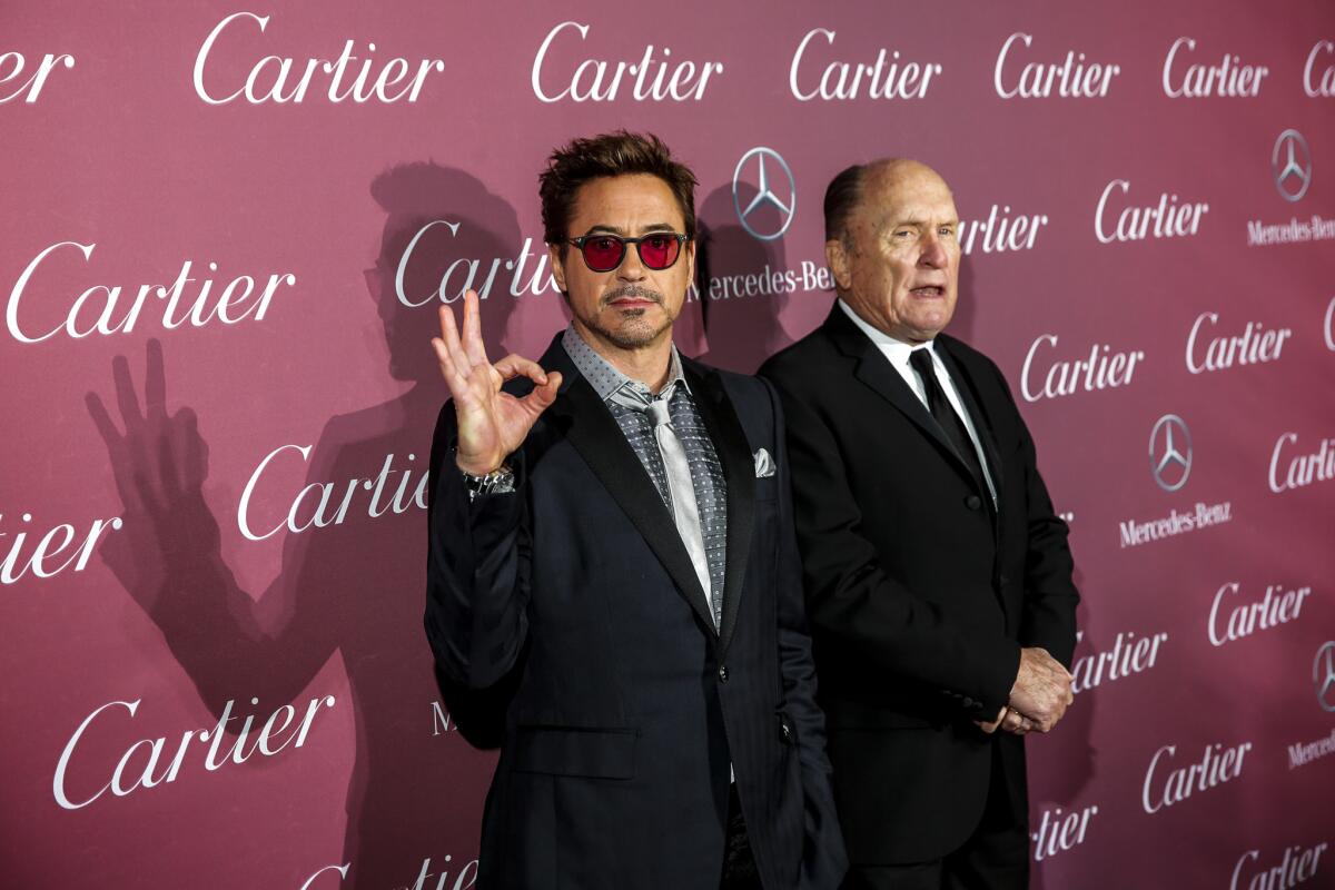 Robert Downey Jr. and Robert Duvall, co-stars of "The Judge," appear on the red carpet Saturday at the Palm Springs International Film Festival awards gala.