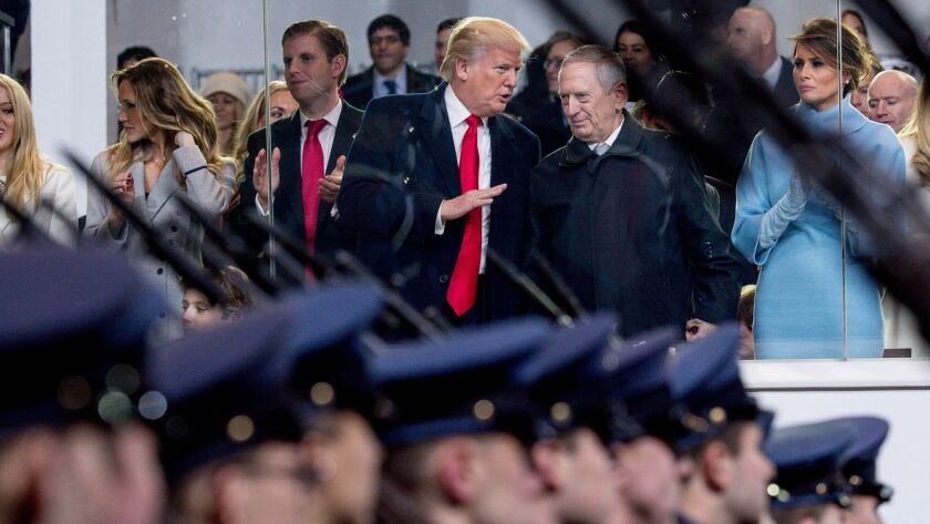 President Donald Trump talks with now Defense Secretary James Mattis in the reviewing stand for Trump's inaugural parade on Pennsylvania Avenue Jan. 20, 2017.
