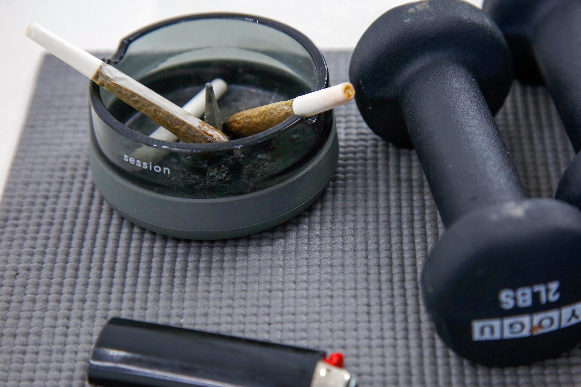 A pair of joints, hand weights and lighter are the required equipment for Stoned + Toned instructors.