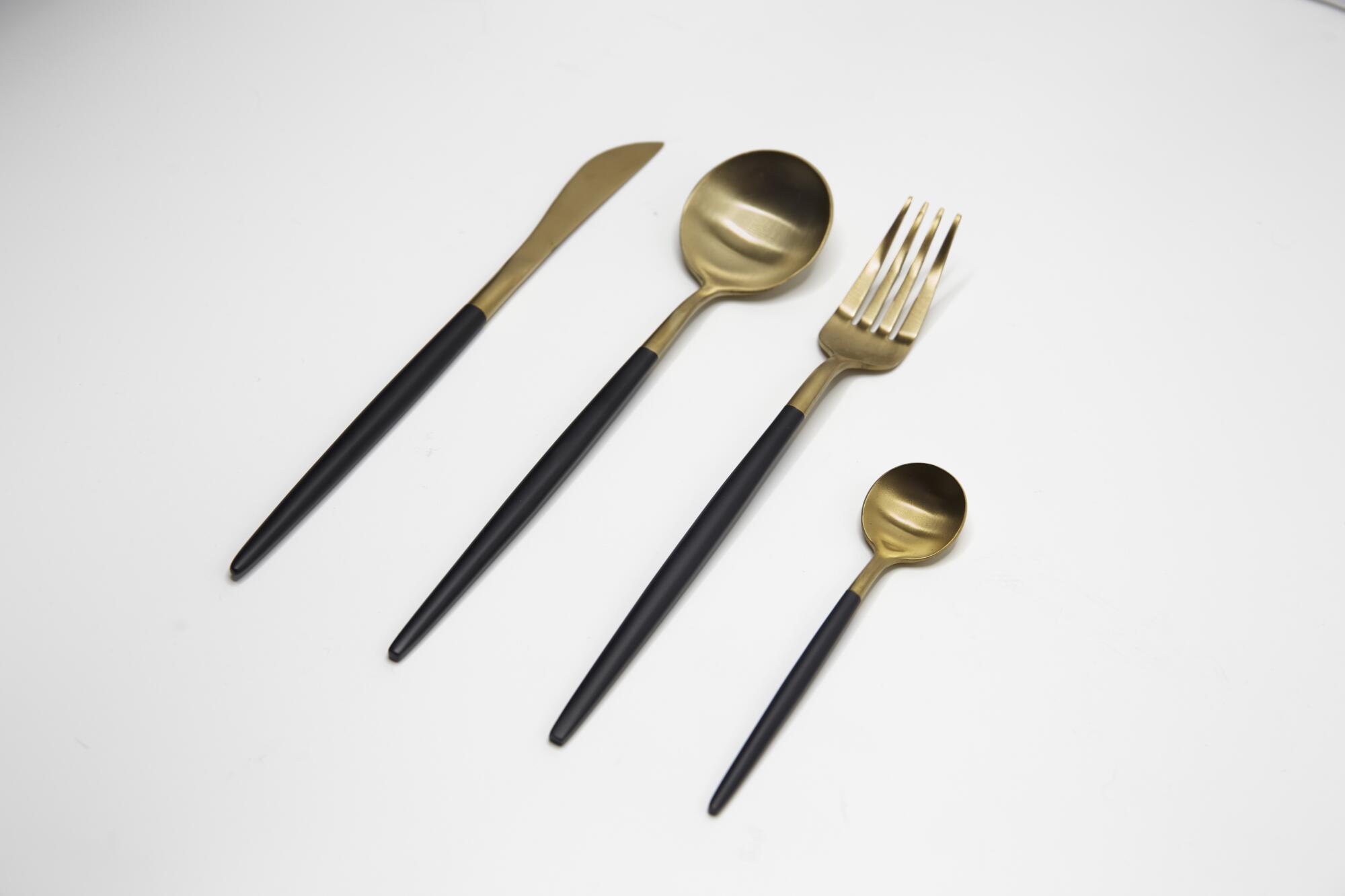 Gold and matte black four-piece set of dishwasher safe utensils