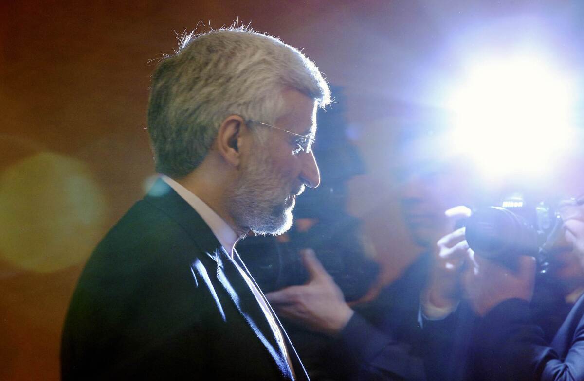 Iran's chief nuclear negotiator Saeed Jalili leaves a news conference in Almaty, Kazakhstan after talks with six world powers.