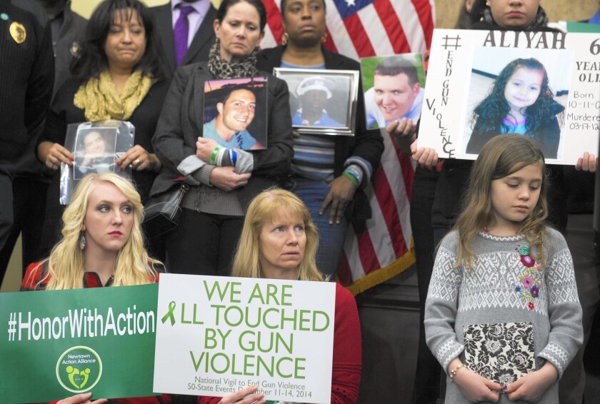 Relatives of gun violence victims and gun control advocates held a news conference in Washington on Dec. 10, 2014, two years after the Sandy Hook shooting, to urge lawmakers to expand background checks.