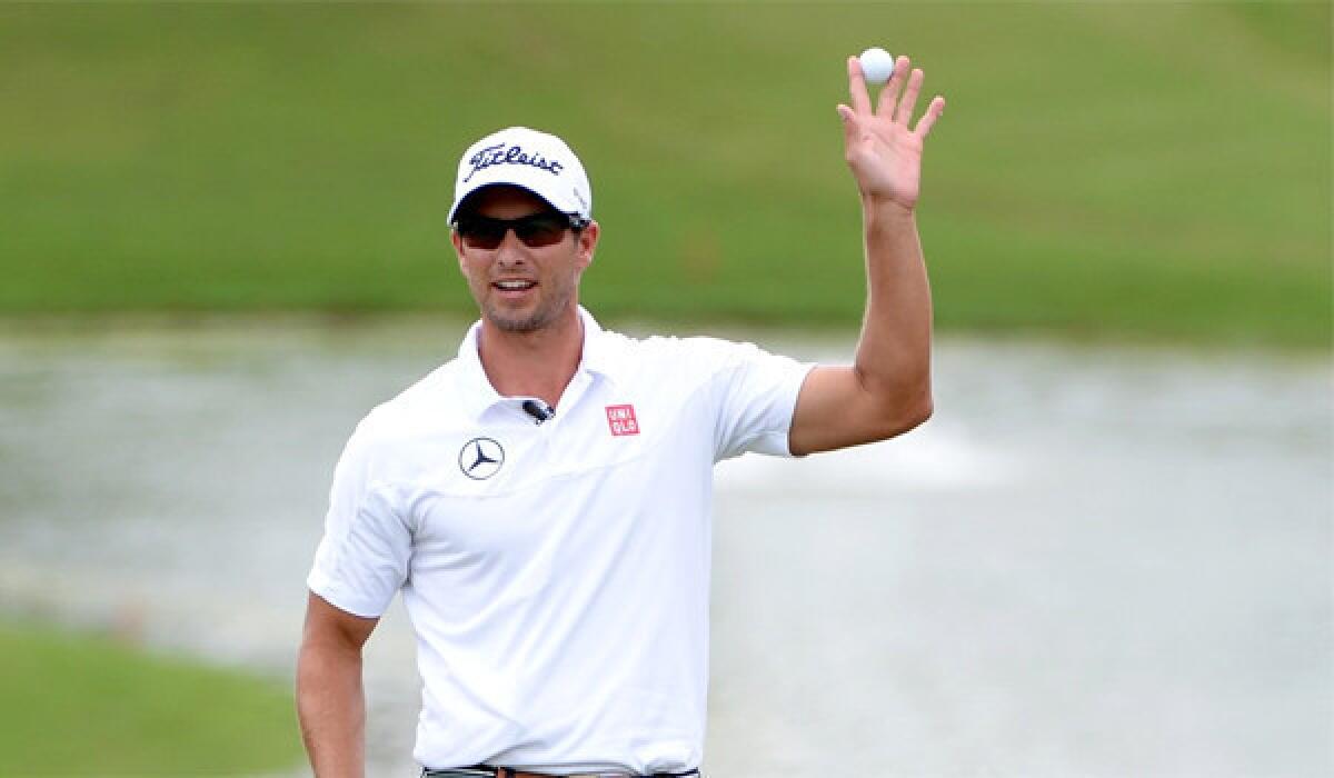 Adam Scott of Australia celebrates after making the winning putt during the final round of the PGA Grand Slam of Golf at Port Royal Golf Course in Southampton, Bermuda.