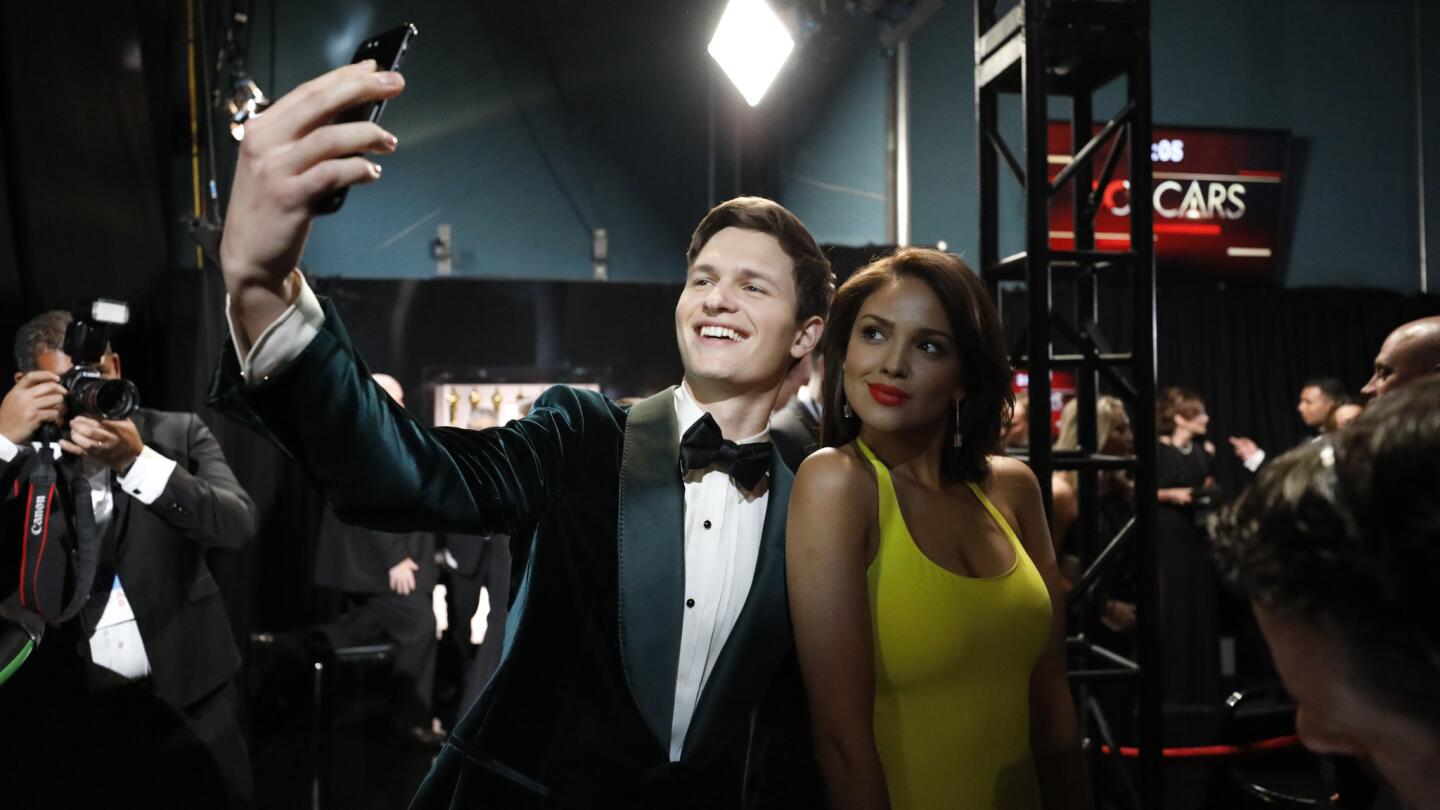 Ansel Elgort and Eiza Gonzalez backstage at the 90th Academy Awards on Sunday at the Dolby Theatre in Hollywood.