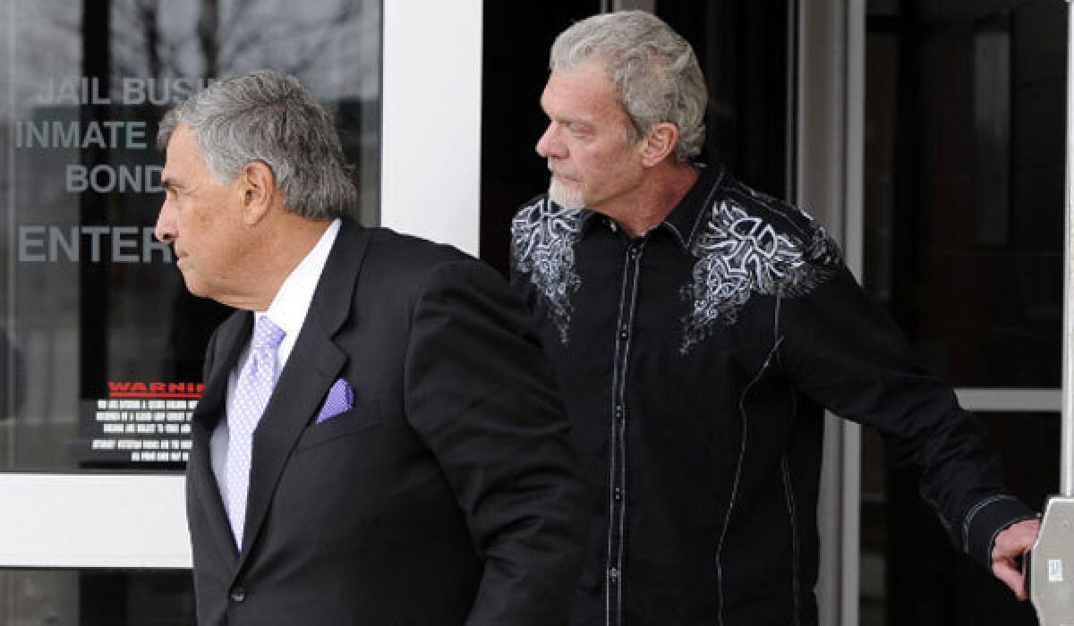 Indianapolis Colts owner Jim Irsay, right, leaves the Hamilton County jail with attorney James Voyles on March 17.