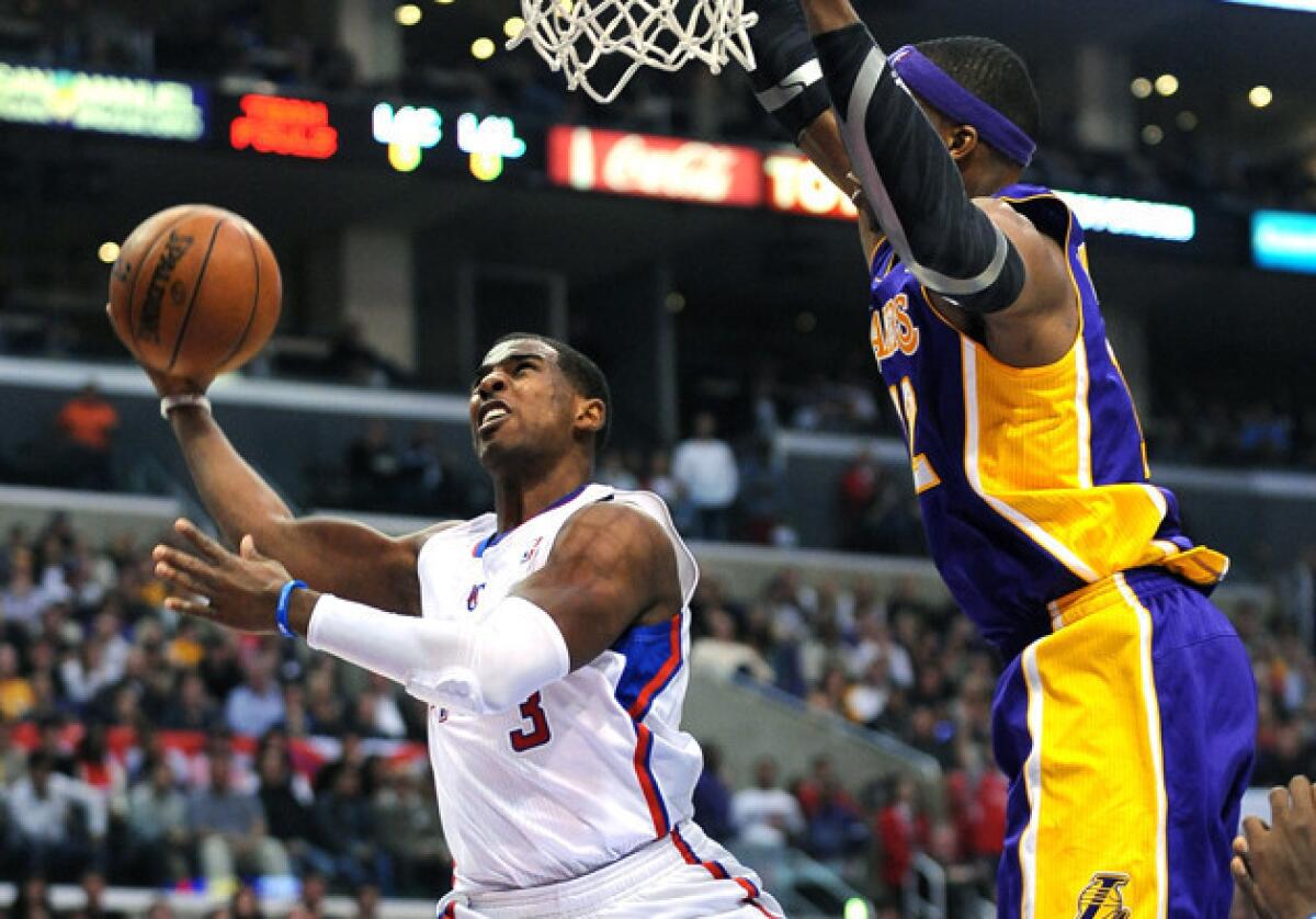 Clippers guard Chris Paul, left, and Lakers center Dwight Howard were mentioned as possible acquisitions in a letter that the Hawks sent to their fans.