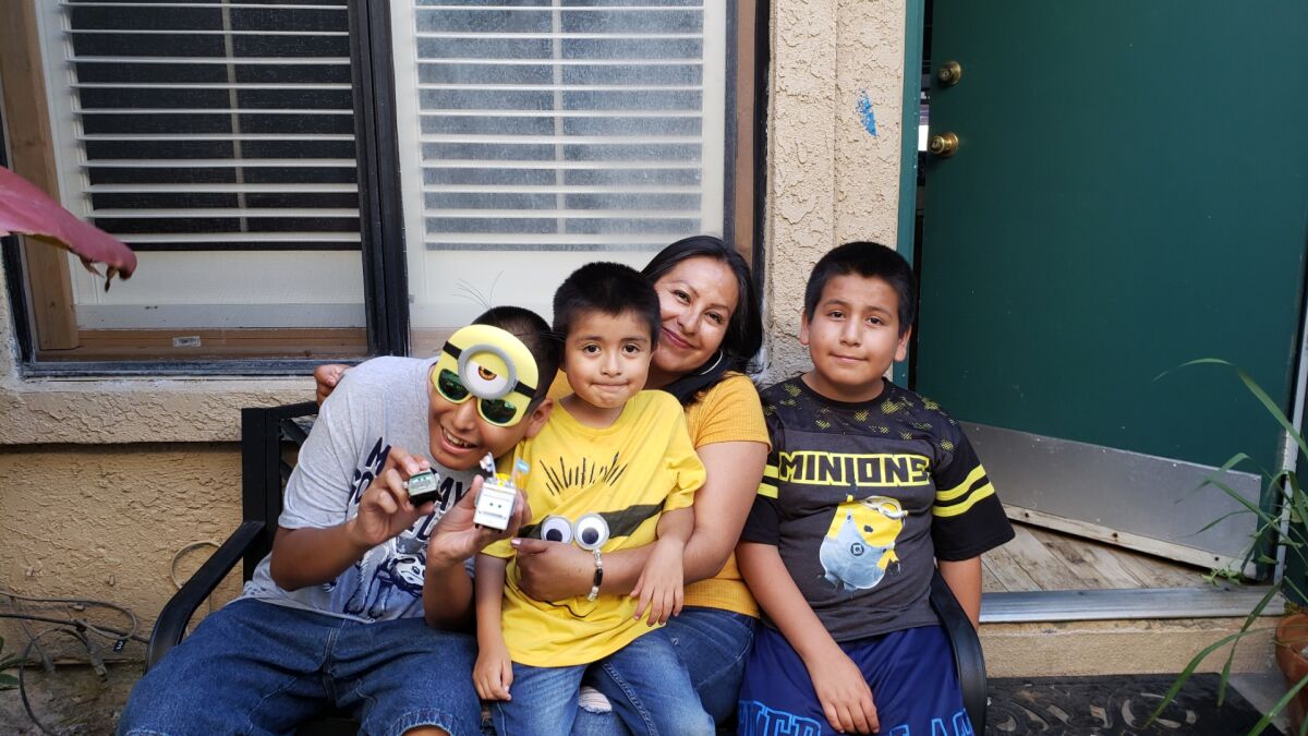 Manny Perez, 15, with his family at a recent birthday party.