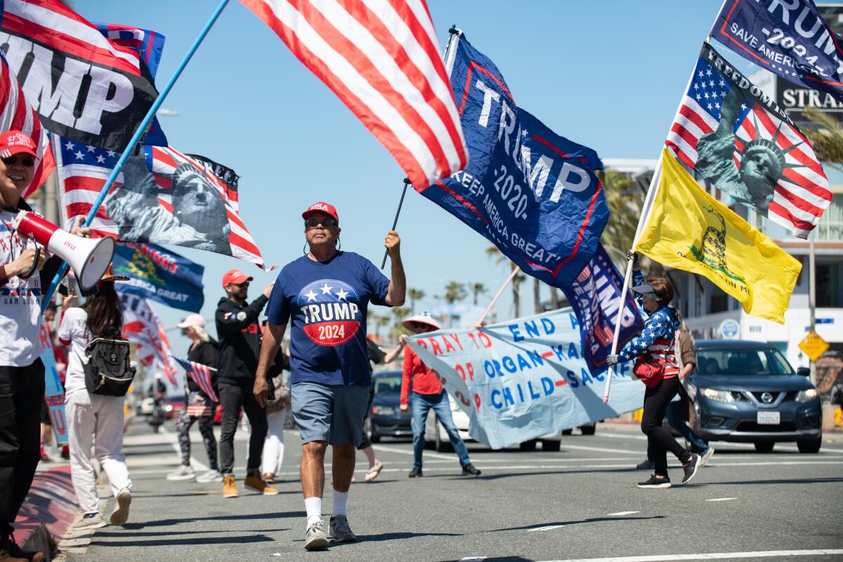 Trump supporters rally in Huntington Beach Saturday.