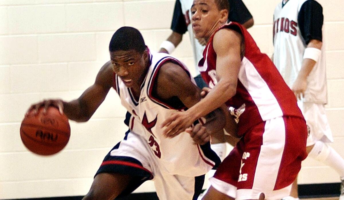 Demetrius Walker, at left during an AAU game, was a can't-miss kid as a 12-year-old in Fontana but was eventually kicked off his college team.