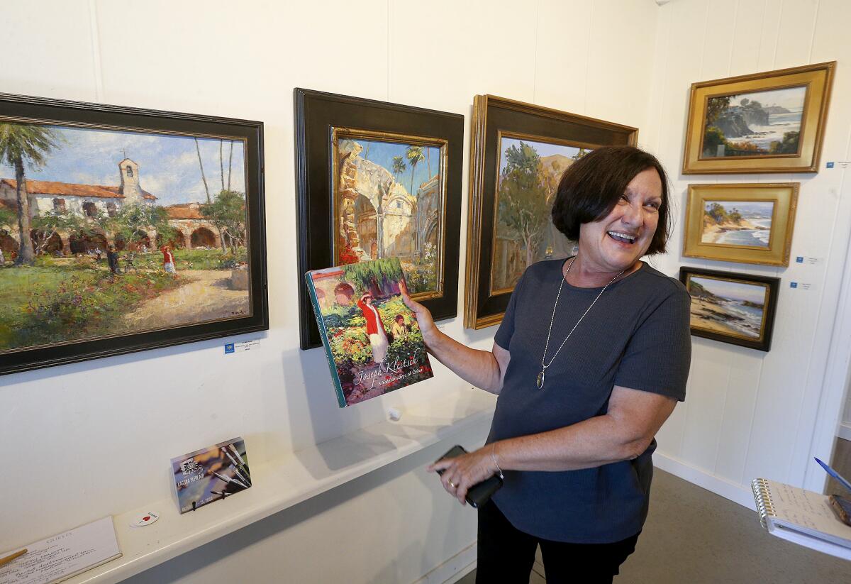 Laguna Plein Air Painters Assn. President Toni Kellenberg chats with guests during its annual Dusk to Dawn juried art show.