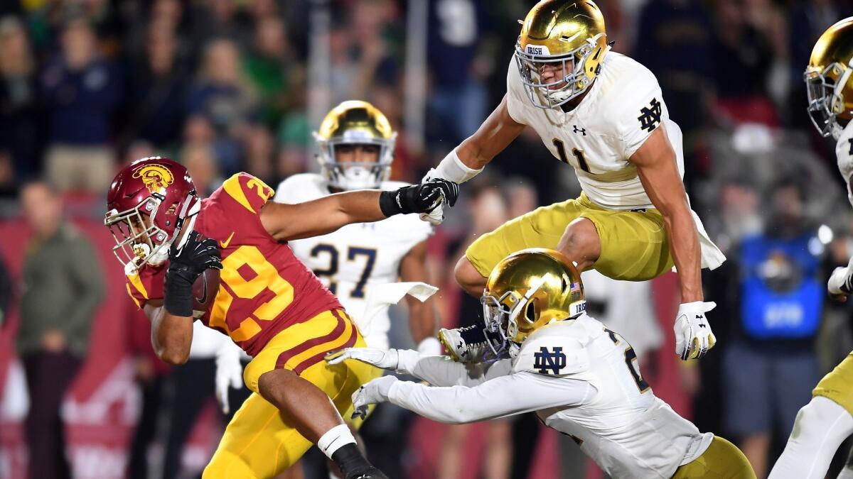 USC running back Vavae Malepeai scores a touchdown against Notre Dame.