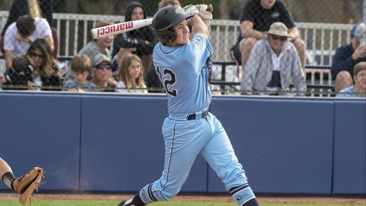 Kieran Sidebotham, shown swinging the bat on April 6, hit a walk-off RBI single in Corona del Mar High's 2-1 win against Northwood on Friday.