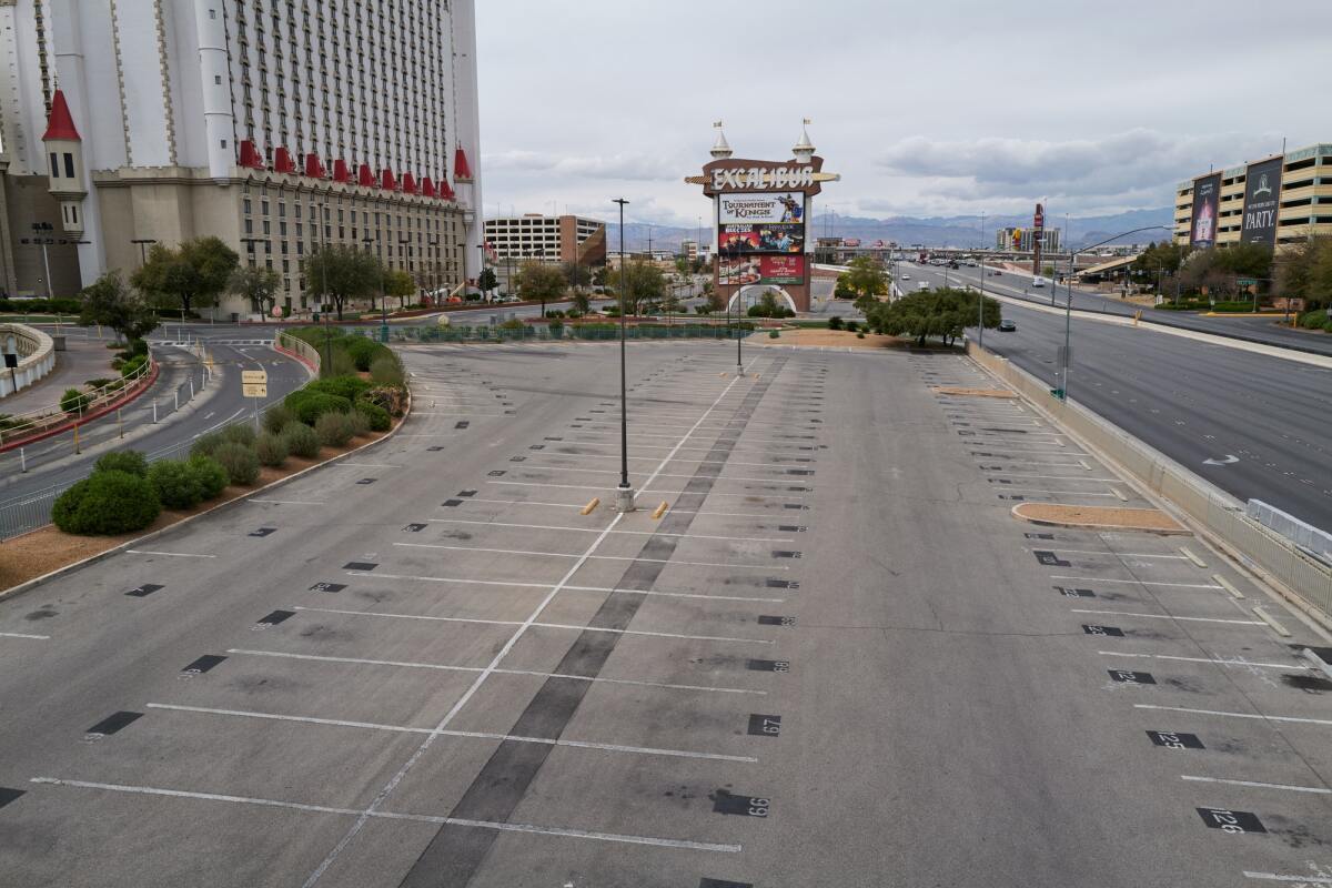 Never thought cars would be missed on the Las Vegas Strip. The emptiness, as reflected in the parking lots and casinos.