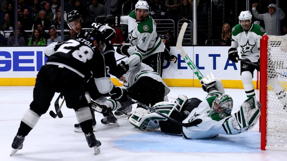 Dallas Stars goalie Kari Lehtonen makes a glove save on a shot by Kings center Jarret Stoll, left, during the second period of the Kings' 2-0 loss Thursday.