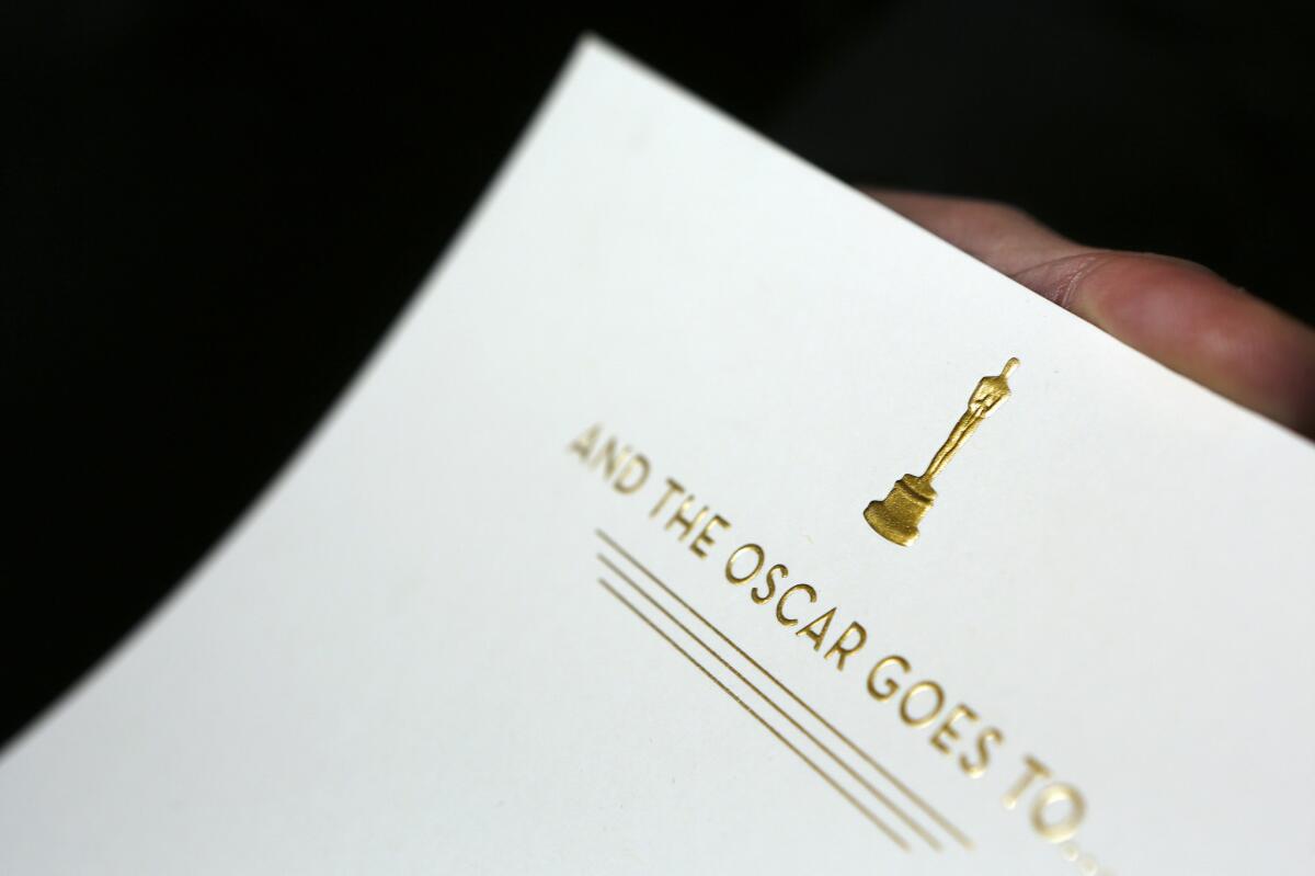Creative Director Marc Friedland holds the card that is placed inside the famous Oscar envelopes for the Academy Awards show. There are no past versions of the envelopes now, they are created to be iconic, like the statuette.