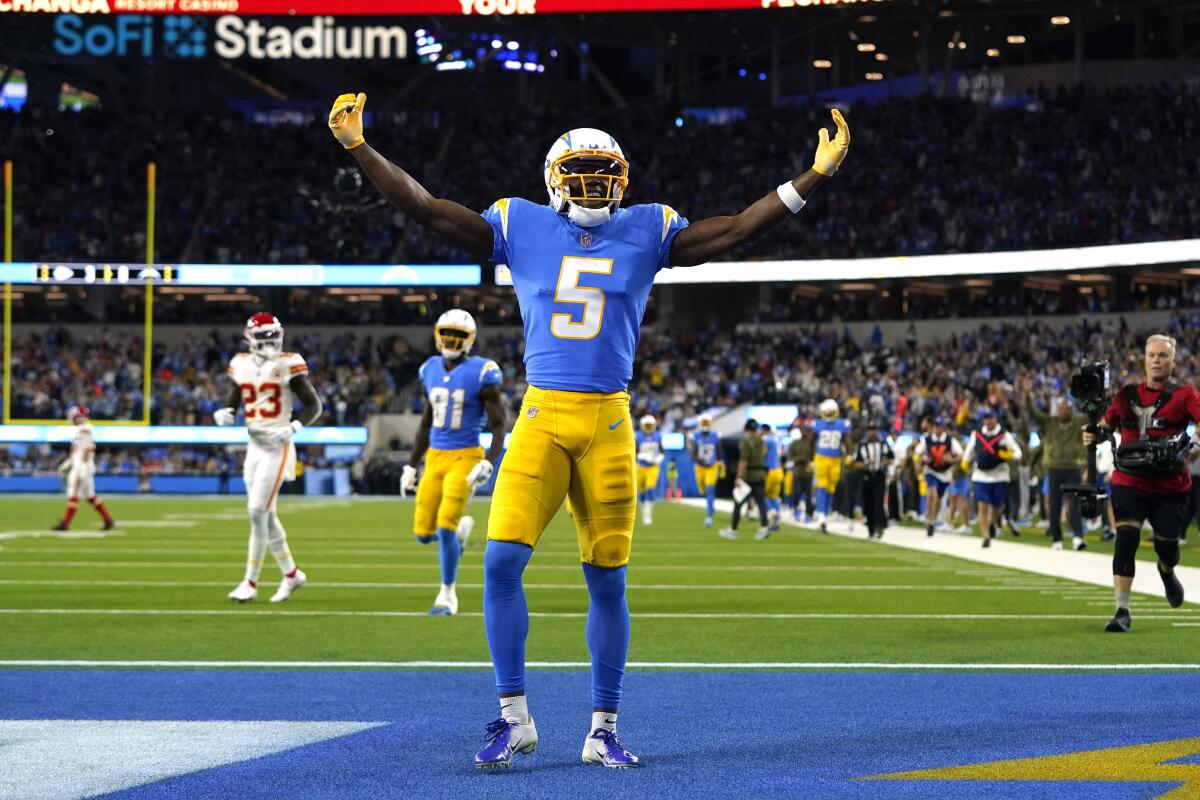 Chargers receiver Joshua Palmer celebrates after making a touchdown catch against the Chiefs
