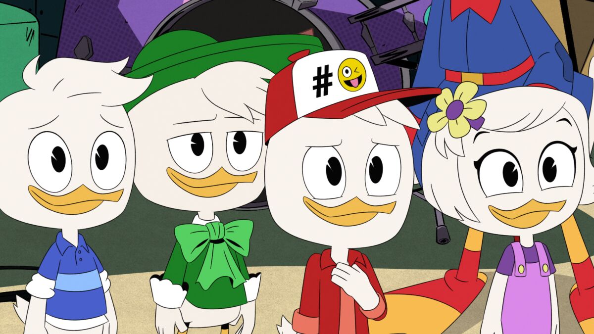 Four young cartoon ducks.