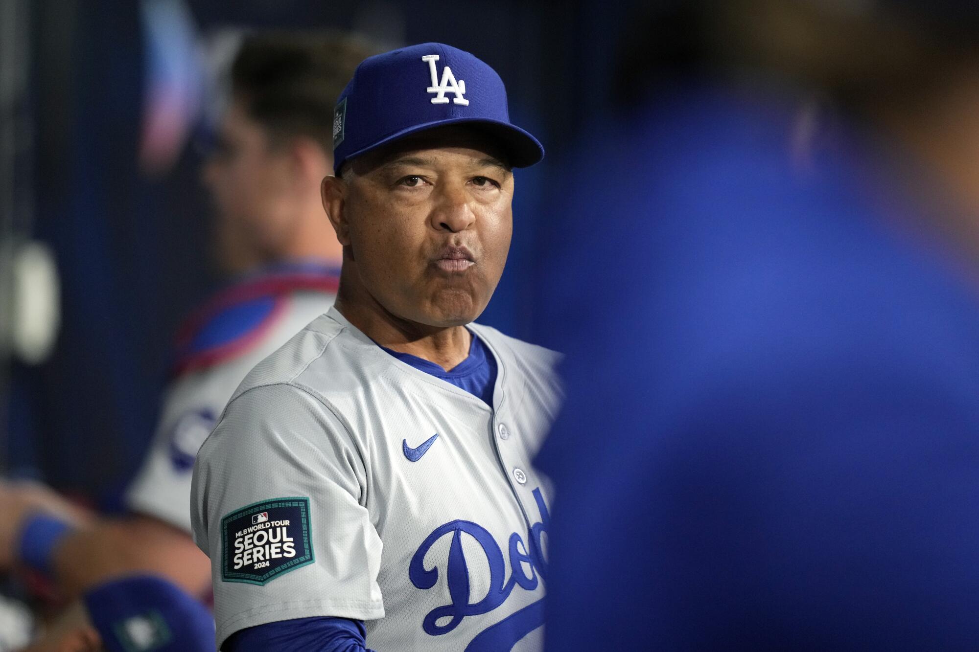 Dodgers manager Dave Roberts stands in the dugout during a game against the San Diego Padres at Gocheok Sky Dome.