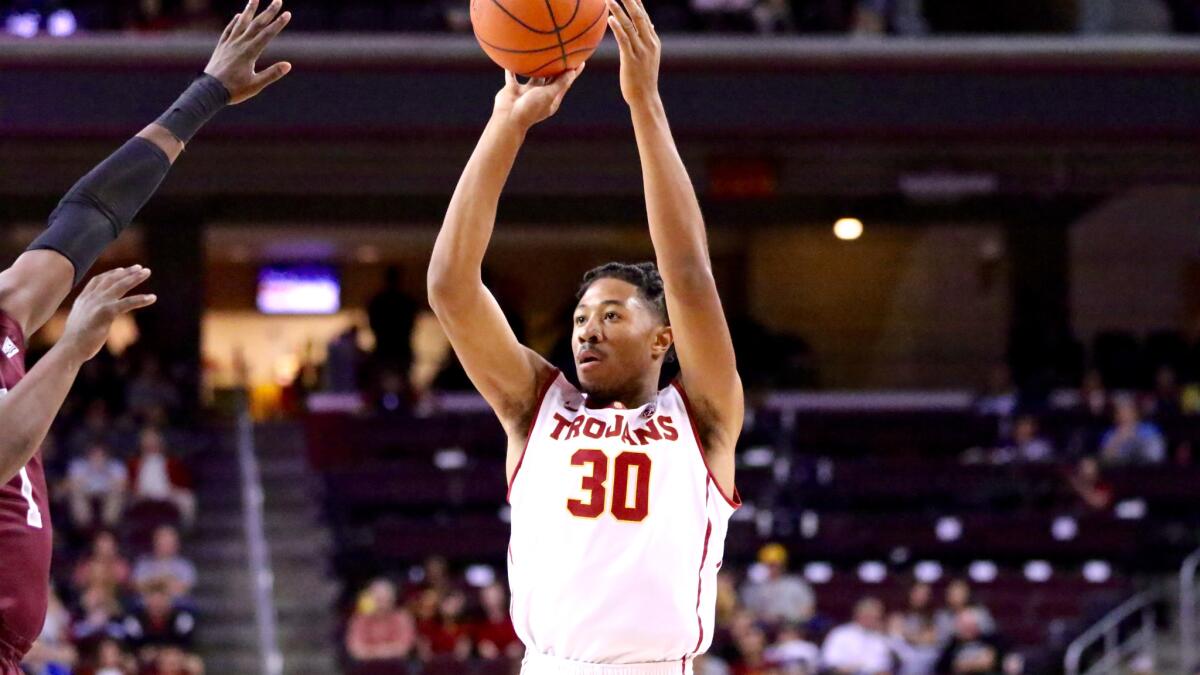 USC guard Elijah Stewart shoots over a Montana defender in the season opener at the Galen Center on Nov. 11. Stewart had 30 points.