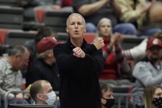 Southern California head coach Andy Enfield directs his team during the second half of an NCAA college basketball game against Washington State, Saturday, Dec. 4, 2021, in Pullman, Wash. (AP Photo/Young Kwak)