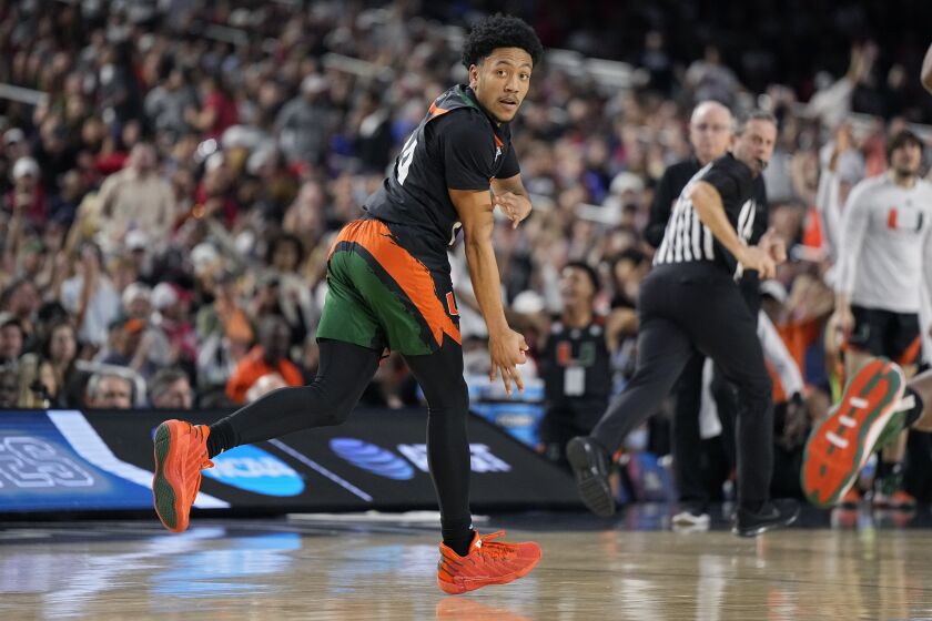 Miami guard Nijel Pack celebrates after scoring against Connecticut during the first half of a Final Four college basketball game in the NCAA Tournament on Saturday, April 1, 2023, in Houston. (AP Photo/Brynn Anderson)