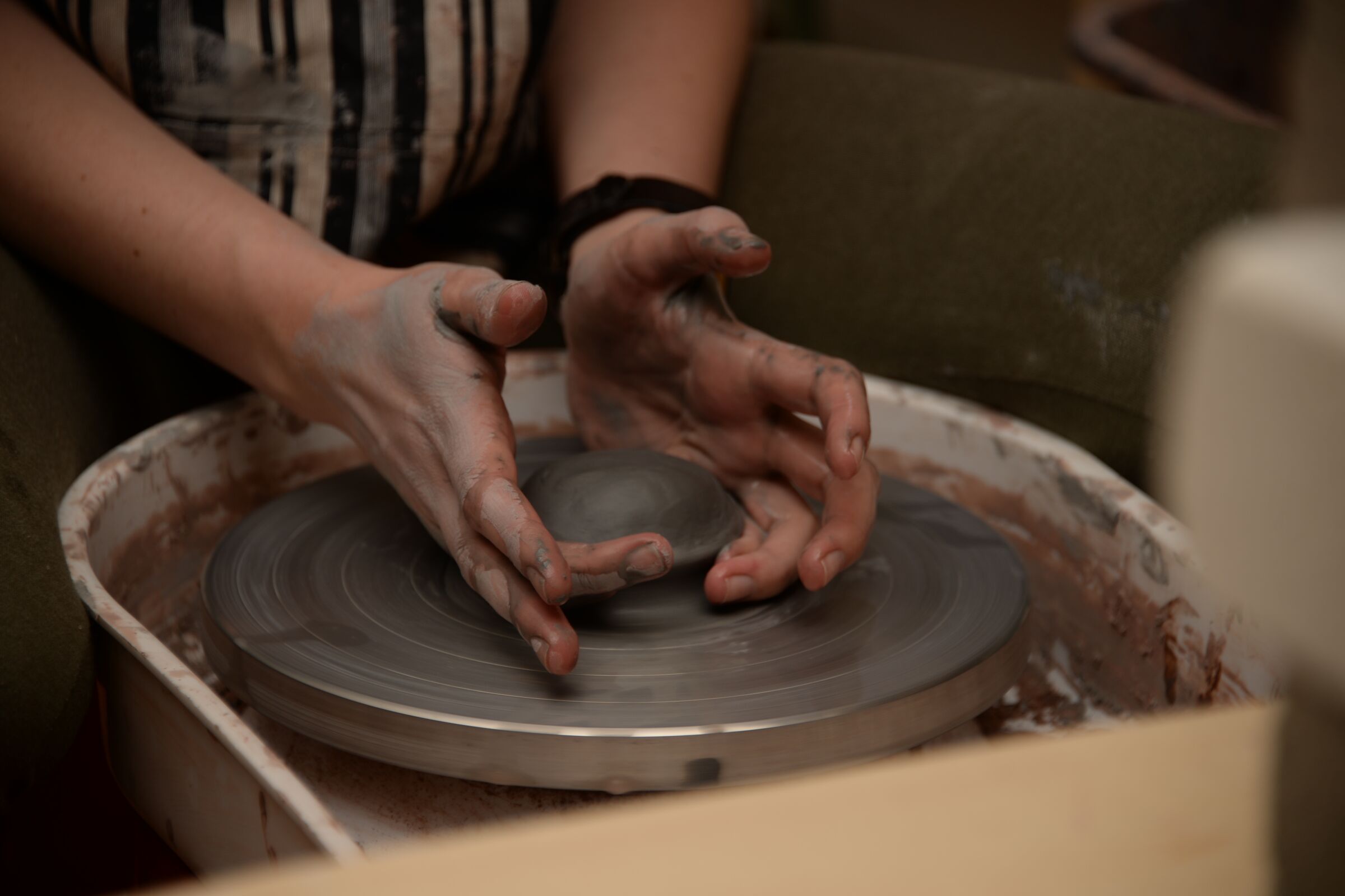 Staff writer Sara Butler attempts making a ceramic on pottery wheel