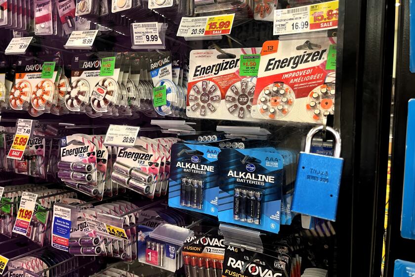 CALABASAS, CA-OCTOBER 19, 2022: Batteries are locked up behind a glass showcase at a Ralphs market in Calabasas. Retail chains are adding more security measures to combat retail theft. (Mel Melcon / Los Angeles Times)