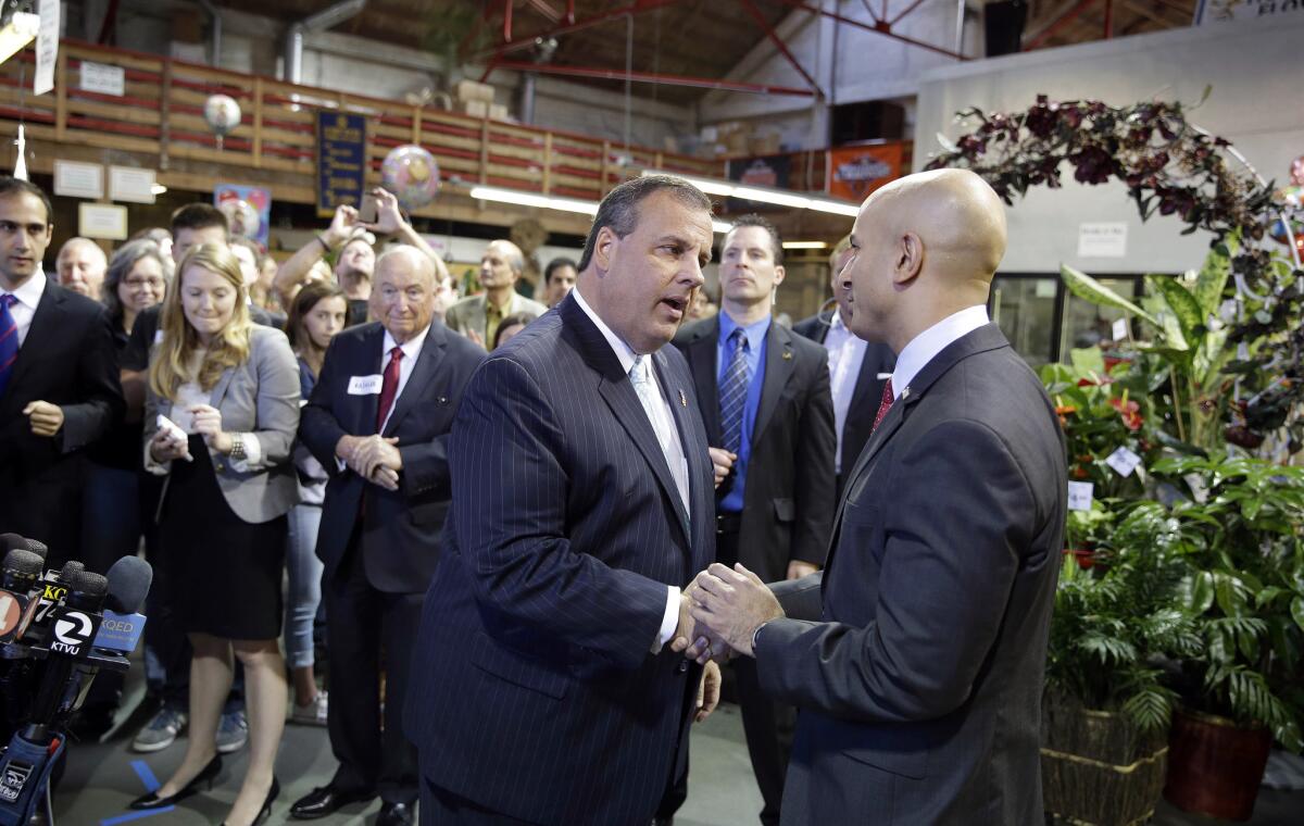 New Jersey Gov. Chris Christie, left, shakes hands with California gubernatorial candidate Neel Kashkari in San Francisco last year.