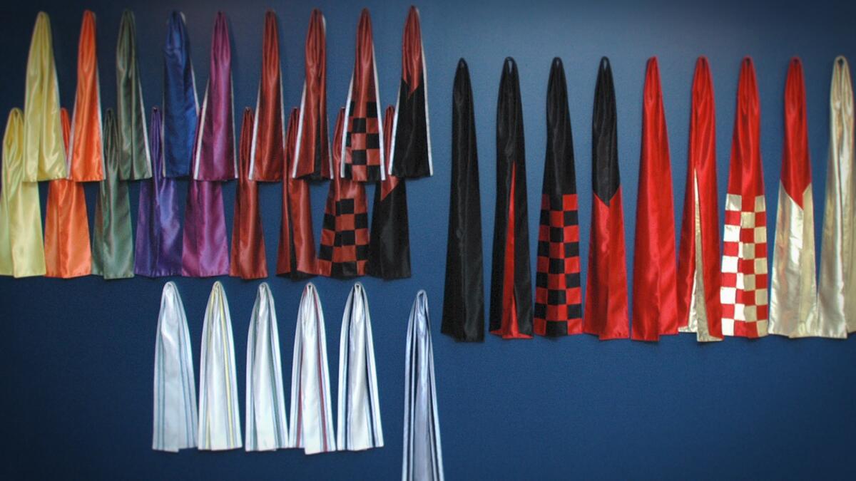 Color-coded sashes worn by members of NXIVM to denote their ranking within the organization.