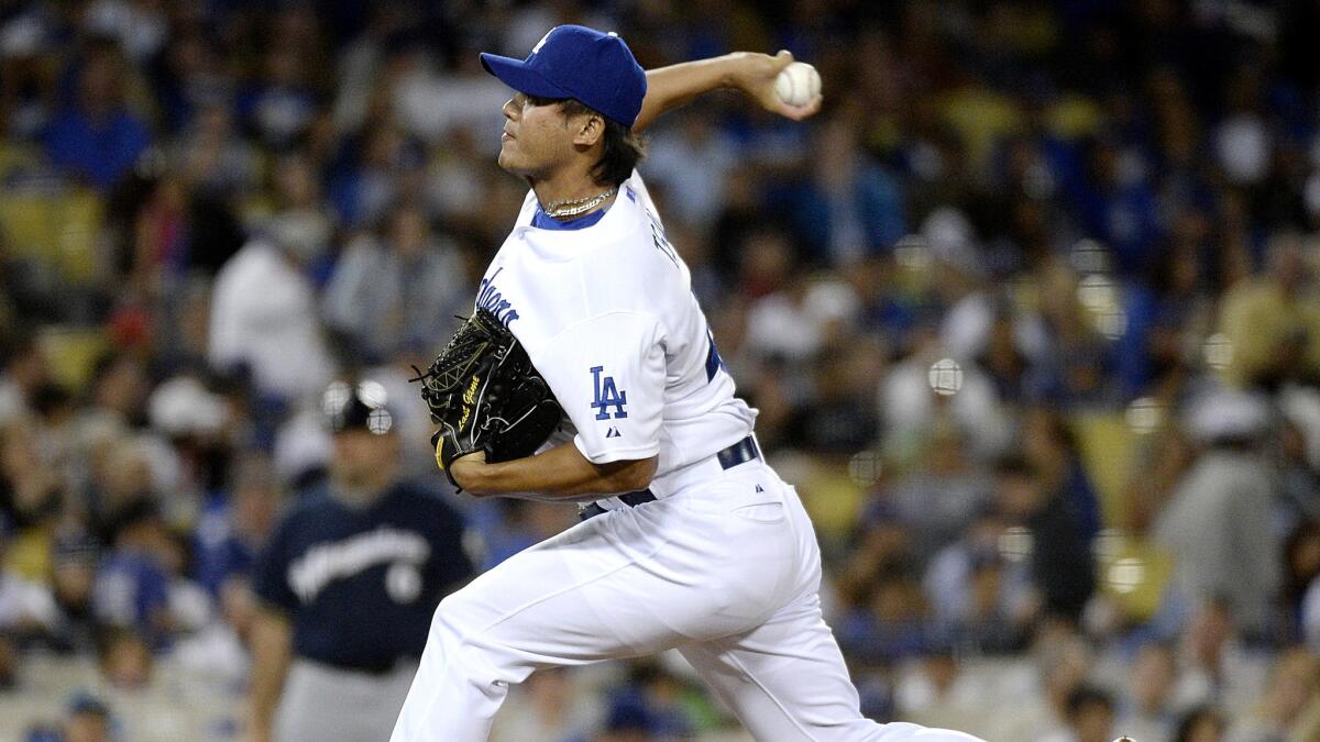 Dodgers reliever Chin-Hui Tsao delivers a pitch against the Rockies in the seventh inning on July 10, 2015.