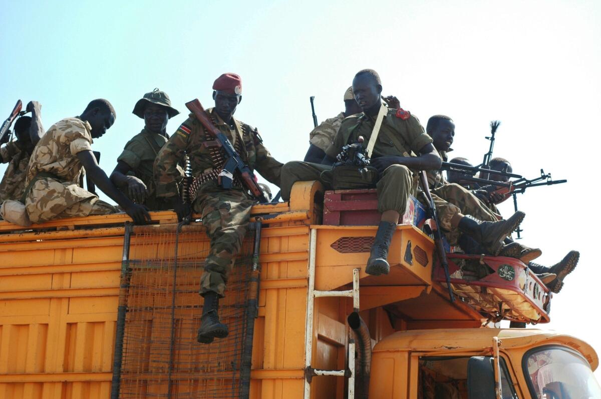 South Sudan government soldiers prepare to deploy from the capital, Juba, on Monday, toward Bor, the last state capital still in rebel hands after a month of tribal fighting over the country's oil assets.