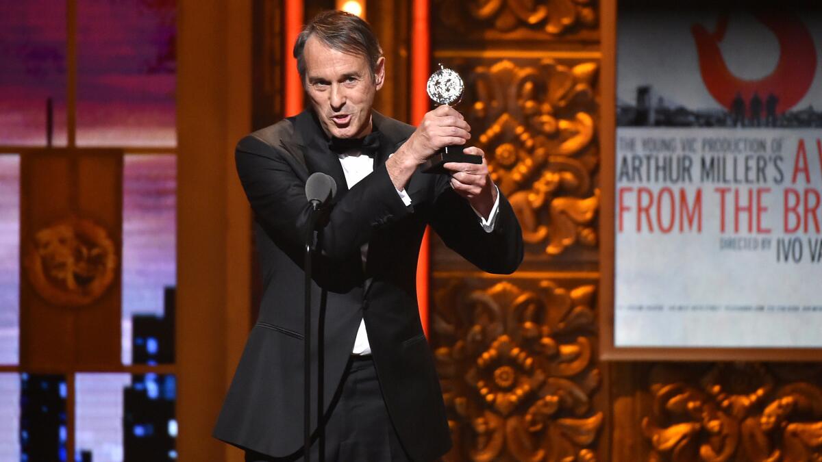 Director Ivo van Hove accepts the Tony Award for direction of a play for "A View From the Bridge" in New York on June 12.