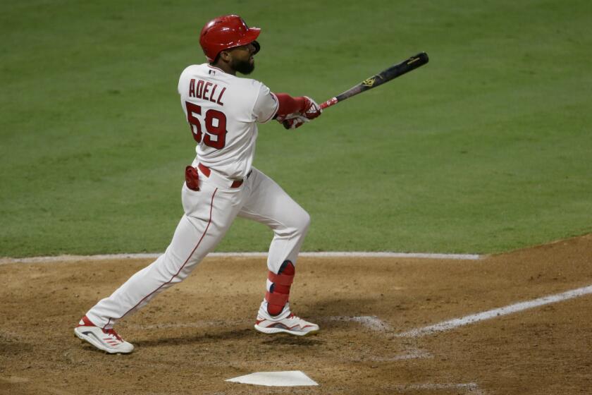 The Angels' Jo Adell hits a sixth-inning home run against the Seattle Mariners on Aug. 29, 2020.